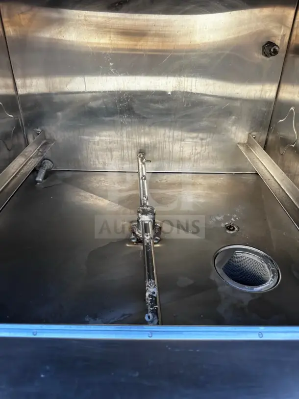 CMA Dishmachines L-1X Undercounter Dishwasher interior, well-maintained, stainless steel, low-temp, 30 racks/hour, 115V.