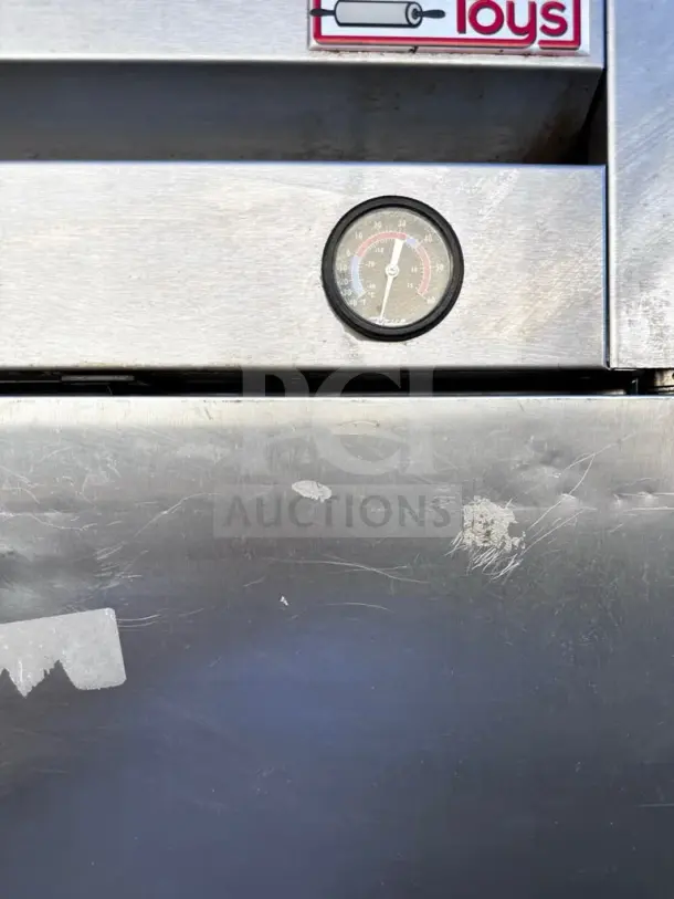 True T-19 reach-in refrigerator with temperature gauge; stainless steel; visible wear; fully tested and operational.