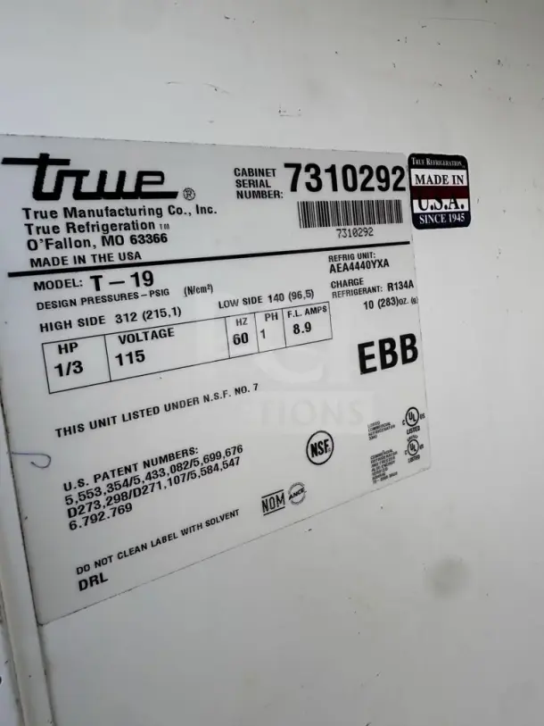 Label of True T-19 refrigerator showing model, serial number, voltage, design pressures, refrigerant type, and certifications.