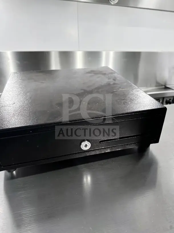 APG Vasario VB452-BL1313 13″ POS cash drawer, high-grade condition, 24VDC, fully tested, black finish, locking front.