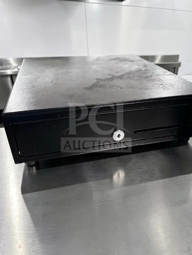 APG Vasario VB452-BL1313 13″ electronic POS cash drawer in high-grade condition; 24VDC, fully tested and operational.