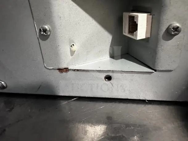 APG Vasario VB452-BL1313 cash drawer corner showing minor wear and an RJ45 port for connectivity. Fully operational.