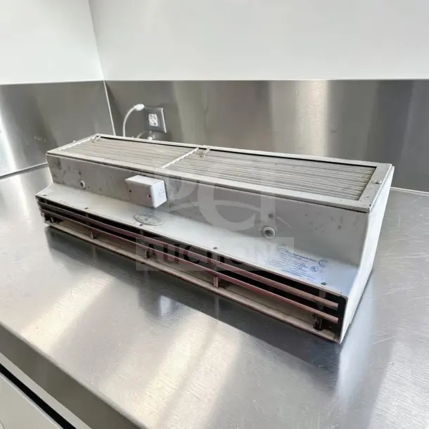 Mars Air Systems 48CH-0 unheated air curtain, 48", UL listed, 115V, shown on a metal surface, tested and operational.