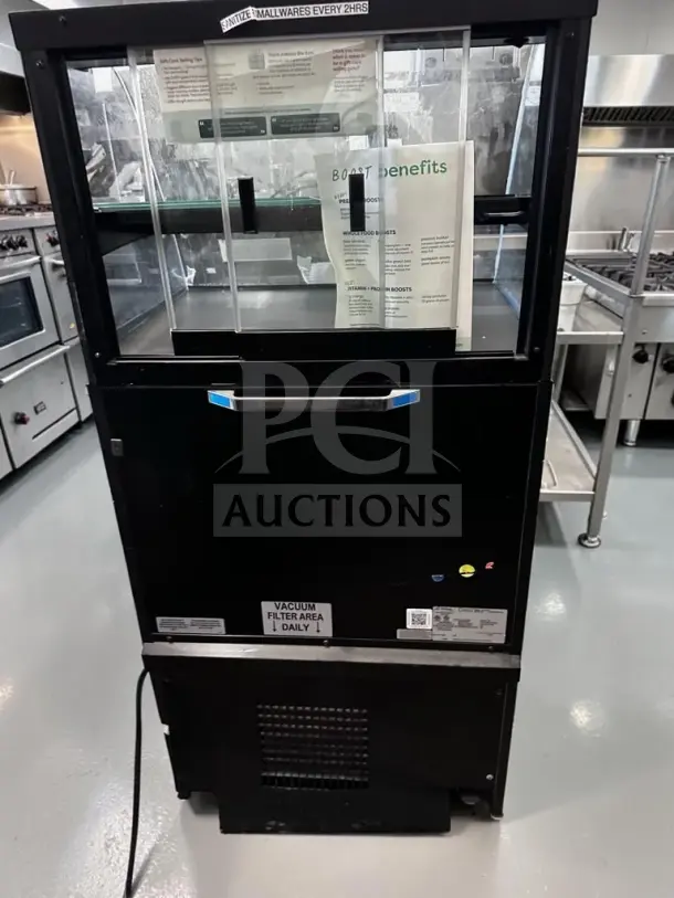 Structural Concepts Oasis COU2757R, 27½" dual-temp merchandiser, excellent condition, black, labels for cleaning instructions.