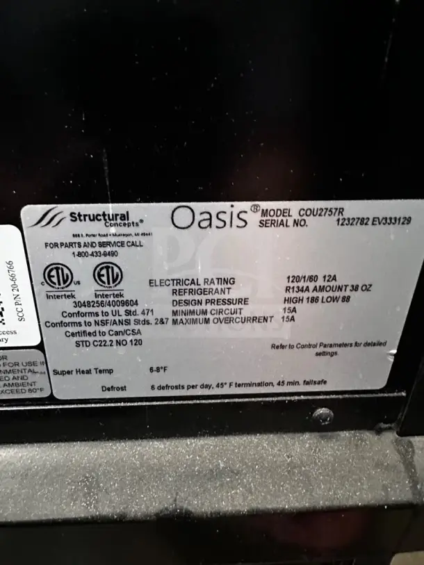 Structural Concepts Oasis COU2757R merchandiser label. Indicates model, serial number, electrical rating, and refrigerant details.