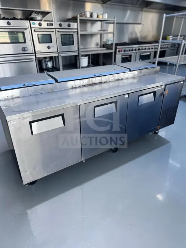 True TPP-93 three-door refrigerated pizza prep table, exceptional condition, 93", 12-pan capacity, 115V.