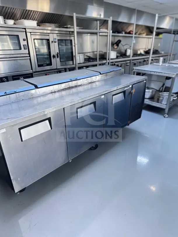 True TPP-93 refrigerated pizza prep table, 93" with three doors, 12 1/3-size pan capacity, fully tested, excellent condition.
