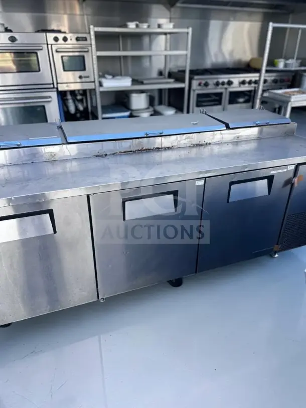 True TPP-93 refrigerated pizza prep table, 93-inch, three-door, 12 pan capacity, stainless steel, excellent condition.