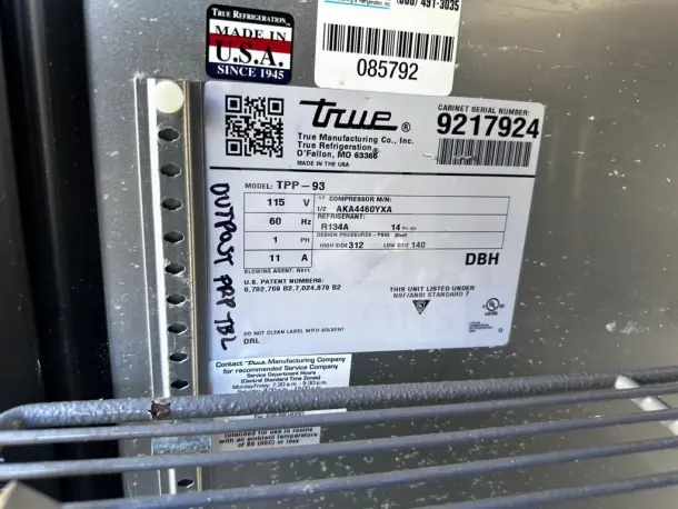 True TPP-93 label showing model, voltage, refrigerant info, and patent numbers. Marked "OUTPOST PRP TBL" for reference.