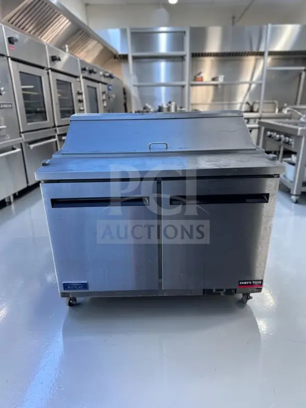 Arctic Air AST48RZ refrigerated prep table, two-door, 12-pan capacity, stainless steel, fully tested, operational condition.
