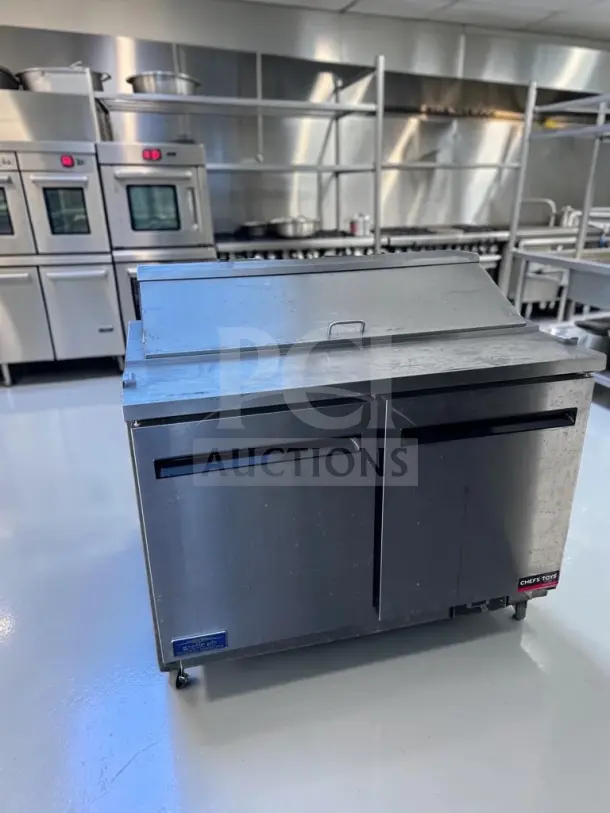 Arctic Air AST48RZ 48" two-door refrigerated prep table, 12-pan capacity, 115V, tested, operational, stainless steel finish.