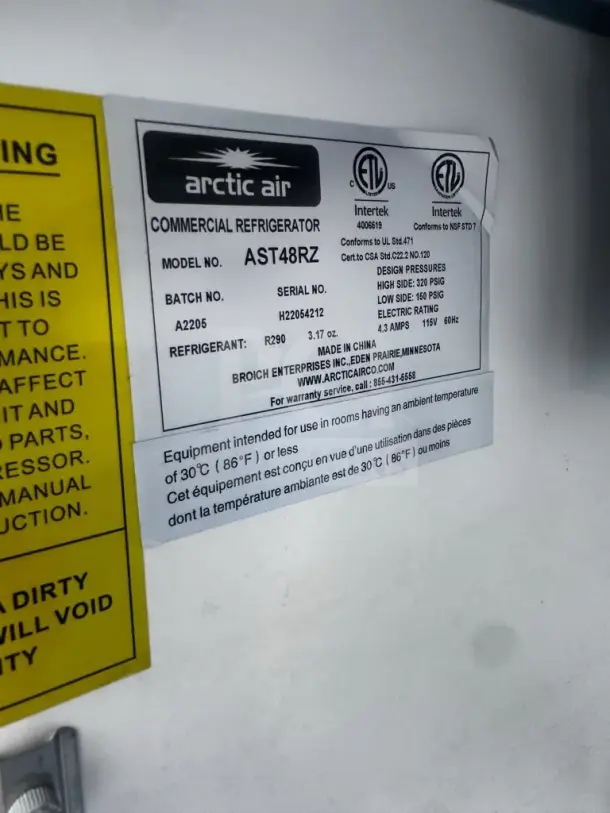 Arctic Air AST48RZ label with model, batch, and serial number details. Designed for 115V, tested and operational.