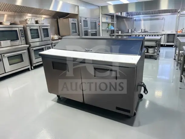 True TSSU-60-16 refrigerated prep table, 60", two-door, 16-pan capacity, fully tested, in well-maintained condition.