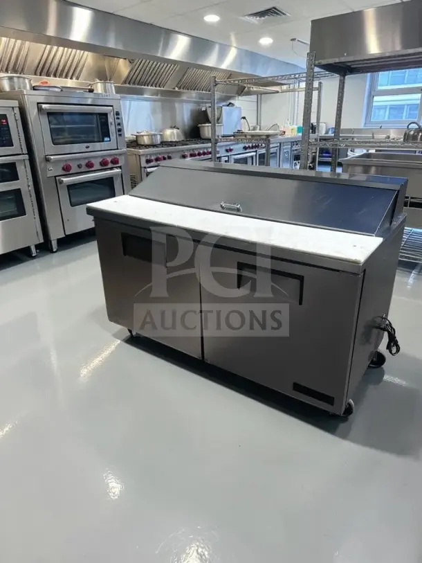 True TSSU-60-16 refrigerated prep table, 60" two-door, 16-pan capacity, stainless steel, well-maintained, 115V.