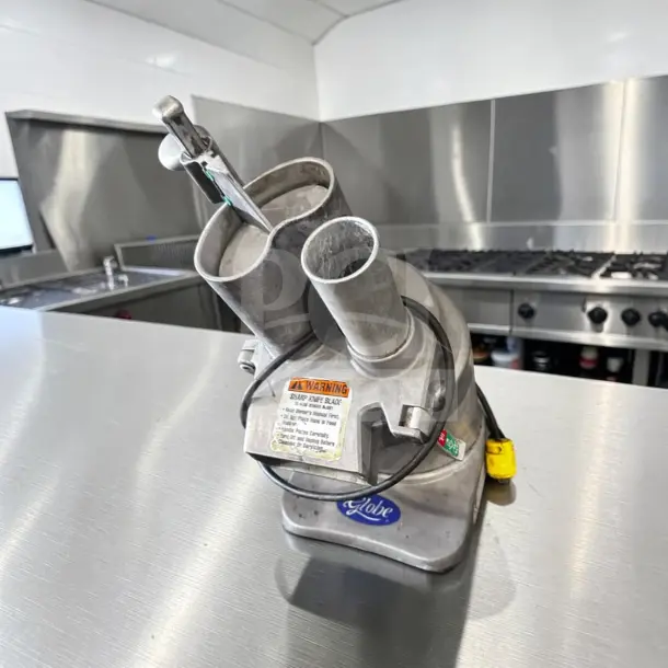 Globe GFP500 food processor, commercial-grade, 600 lb/hr capacity, 1/2 HP, 115V, fully tested, in superior condition.