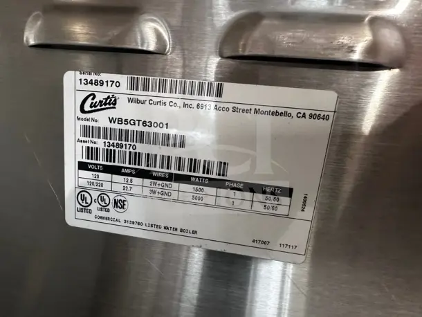 Wilbur Curtis WB5GT63001 hot water dispenser label, showing model, voltage details, and UL, NSF listings.