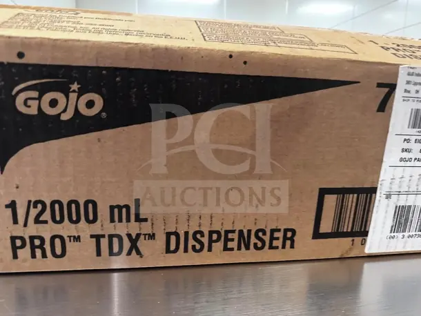 GOJO 7200-01 PRO TDX 2000, 2,000 mL soap & sanitizer dispenser in packaging, new condition, wall-mount ready.