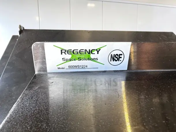 Regency 600WS1224 NSF stainless steel wall shelf, 24"x12", 210-lb capacity, new. Features brand label and model marking.