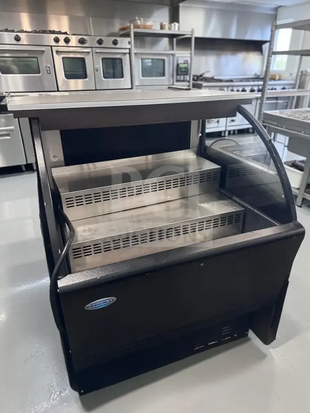 Federal Industries UCR3633C 36″ curved-end refrigerated display case, high-grade condition, black exterior, used commercial equipment.