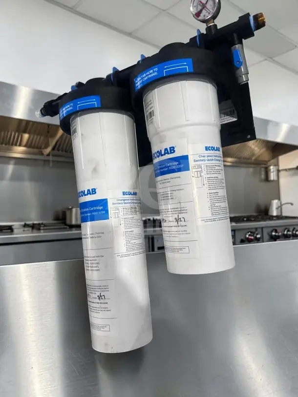 Ecolab 9320-2268 Split Twin water filtration system with ECO-TO20S & ECO-TO14 cartridges, dual pressure gauges, prime condition.