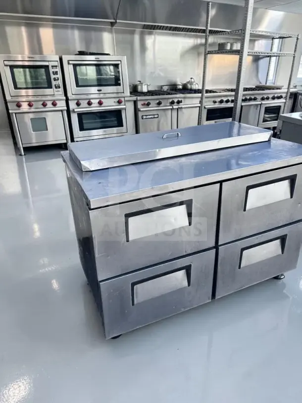 True TSSU-48-12D-4 sandwich/salad prep table in superb condition, features 12-pan refrigerated top, four drawers, tested operational.