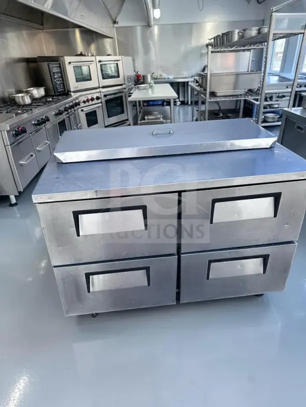 True TSSU-48-12D-4 sandwich/salad prep table in superb condition, 48" wide, four drawers, 12-pan refrigerated top, 115V.