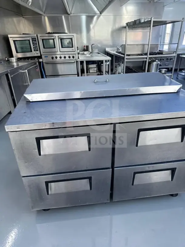 True TSSU-48-12D-4 four-drawer prep table in superb condition, 48" wide, 12-pan refrigerated top, 115V. Fully tested.