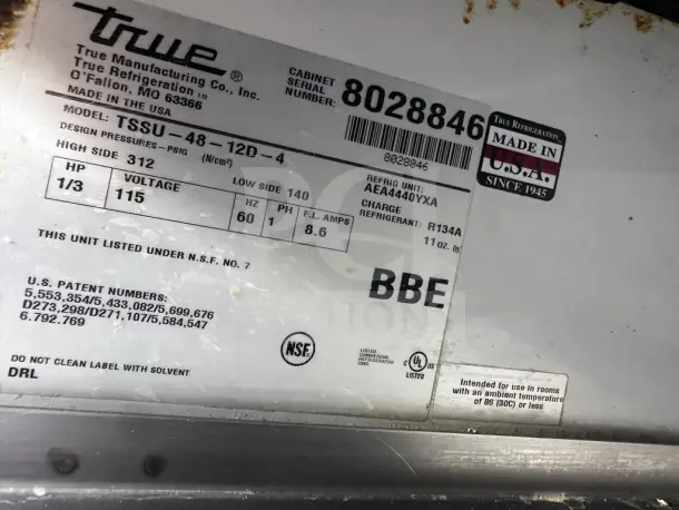 True TSSU-48-12D-4 sandwich prep table label. Features 115V, R134A refrigerant, Made in USA sticker, NSF certified.