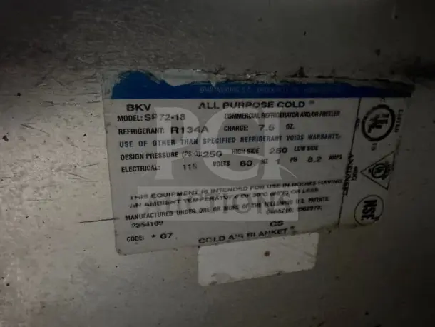 A label detailing specifications for a commercial refrigerator or freezer, model SP-72-18, refrigerant R134A, 115 volts.