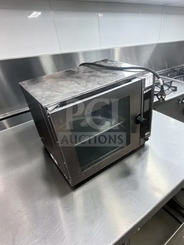 Doyon DCOT5 electric countertop half-size convection oven, 208V, single phase, in superior condition, ETL/NSF certified.