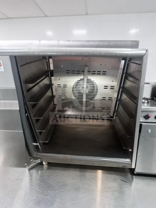 Doyon DCOT5 electric countertop convection oven, in superior condition, 208V, single phase, ETL/NSF certified, interior view.