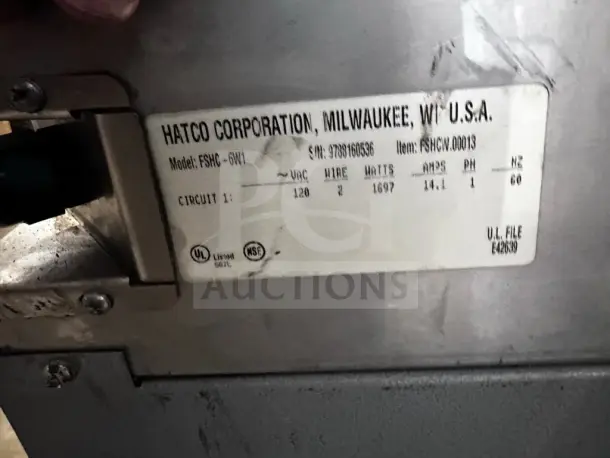 Hatco FSHC-6W1 Flav-R-Savor heated cabinet label showing model details, 120V, 1697 watts, NSF & UL certified, 6-pan capacity.