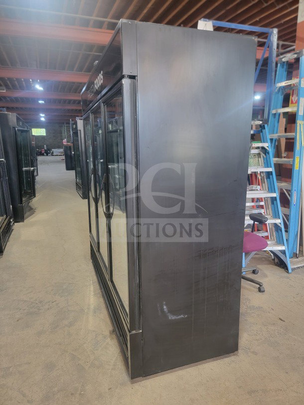 True GDM-72F-HC commercial 3-door glass merchandiser freezer, professional-grade, tested, working, ideal for retail and kitchen use.