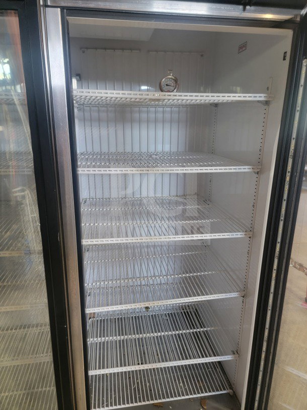 True GDM-72F-HC commercial 3-door glass merchandiser freezer, pristine condition, ideal for stores, tested and fully operational.