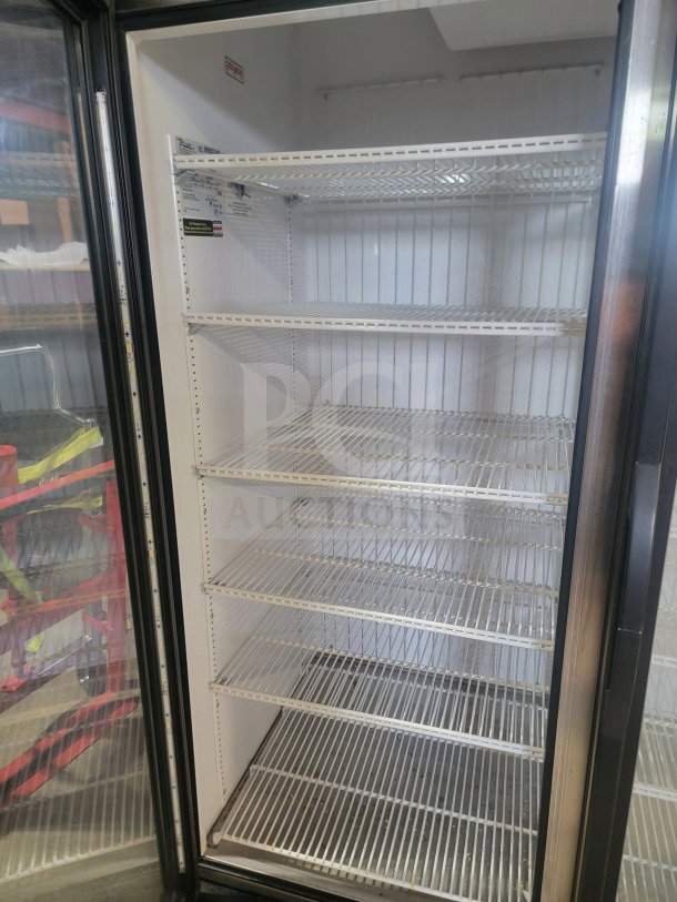 True GDM-72F-HC 3-door glass merchandiser freezer, commercial-grade, tested working, with multiple wire shelves.