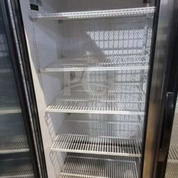 True GDM-72F-HC 3-door glass merchandiser freezer, shelves visible, ideal for commercial use, tested and working.
