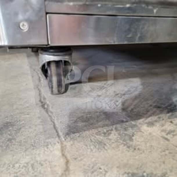 Maxx Cold MCF-49FD commercial reach-in freezer, stainless steel, two doors, caster wheel shown, tested and working.