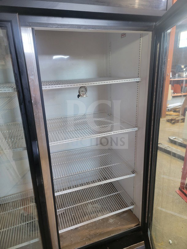 True GDM-49-HC commercial 2-door glass merchandiser refrigerator, tested and working, ideal for retail display.