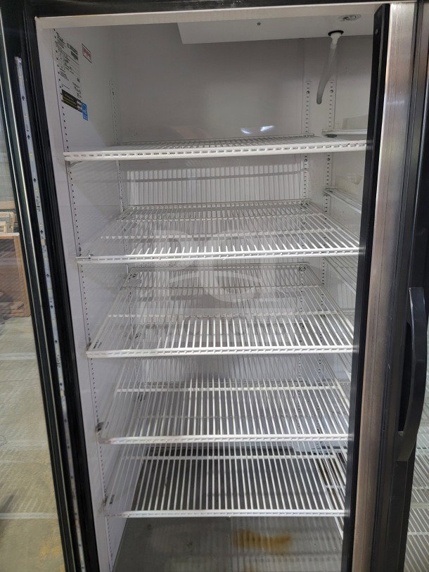 True GDM-49-HC 2-door glass merchandiser refrigerator, serial number 9596595, tested working, shelves visible.