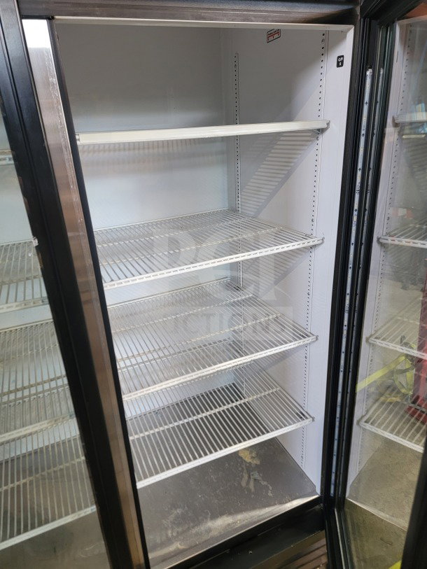 True GDM-72-HC commercial 3-door glass merchandiser refrigerator with adjustable shelves, tested and working condition.