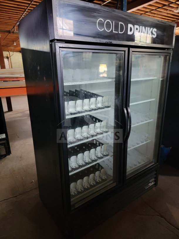 True GDM-49-HC 2-door glass merchandiser refrigerator, tested and working, for commercial display of drinks and products.