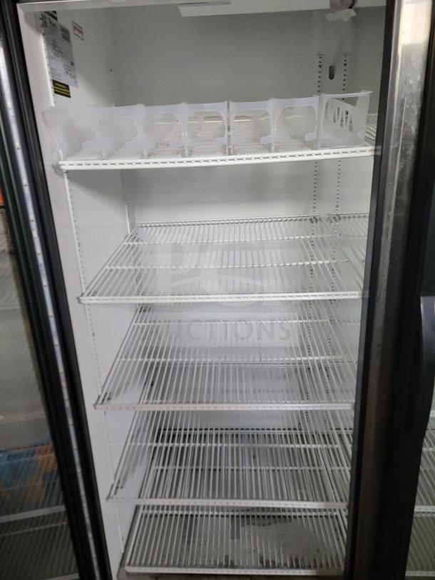 True GDM-49-HC 2-door glass merchandiser fridge with adjustable wire shelves; fully tested, ideal for commercial display.