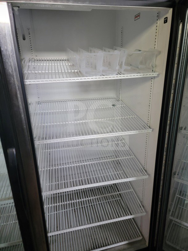 True GDM-49-HC 2-door glass merchandiser refrigerator; spacious interior, adjustable shelves, excellent condition.