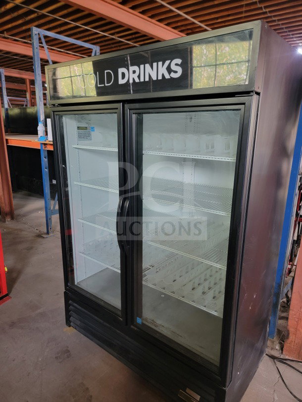 True GDM-49-HC 2-Door Glass Merchandiser Refrigerator, tested, working, ideal for commercial use. "Cold Drinks" sign on top.