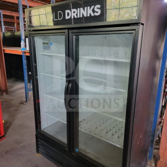 True GDM-49-HC 2-Door Glass Merchandiser Refrigerator, tested, working, ideal for commercial use. "Cold Drinks" sign on top.