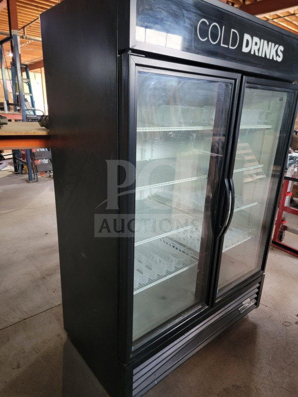 True GDM-49-HC commercial 2-door glass merchandiser refrigerator, tested, working, ideal for beverages, with "Cold Drinks" signage.