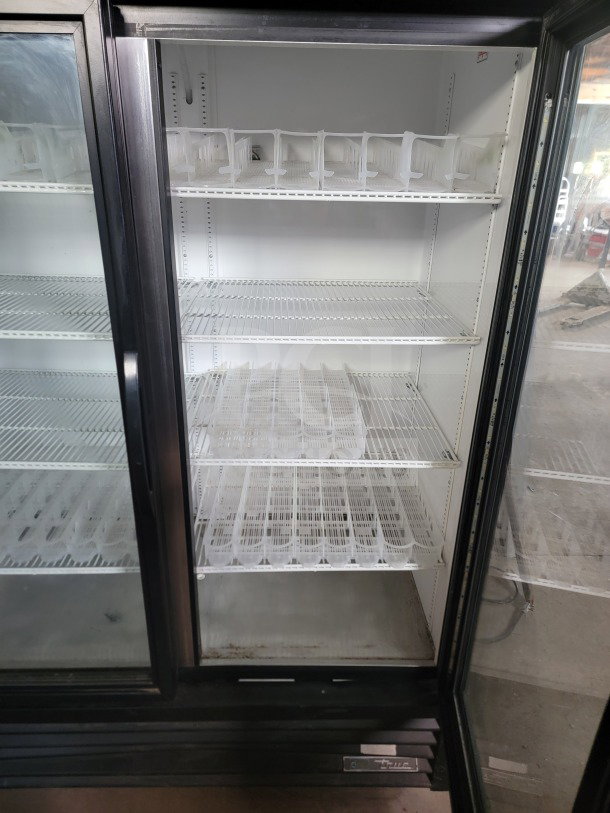 True GDM-49-HC 2-door glass merchandiser refrigerator, tested and working, ideal for commercial display of drinks and products.