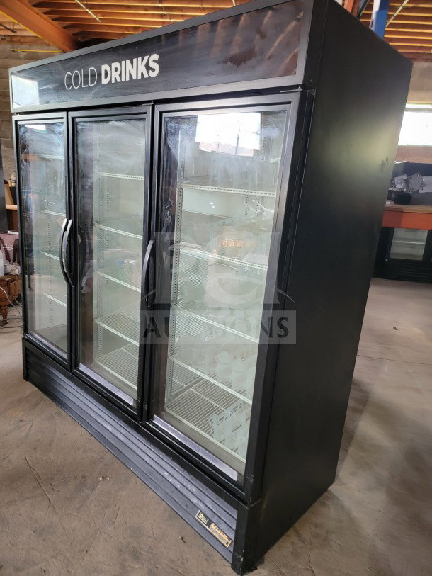 True GDM-72-HC 3-door glass merchandiser refrigerator, black, ample shelving, "Cold Drinks" sign, tested and working.