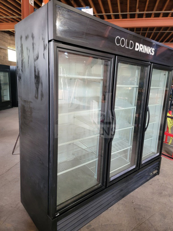 True GDM-72-HC 3-door glass merchandiser refrigerator, black exterior, tested, working, ideal for commercial use.