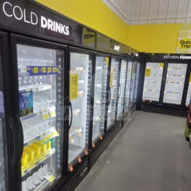 True GDM-72-HC 3-door glass merchandiser refrigerator, tested and working, ideal for commercial display.